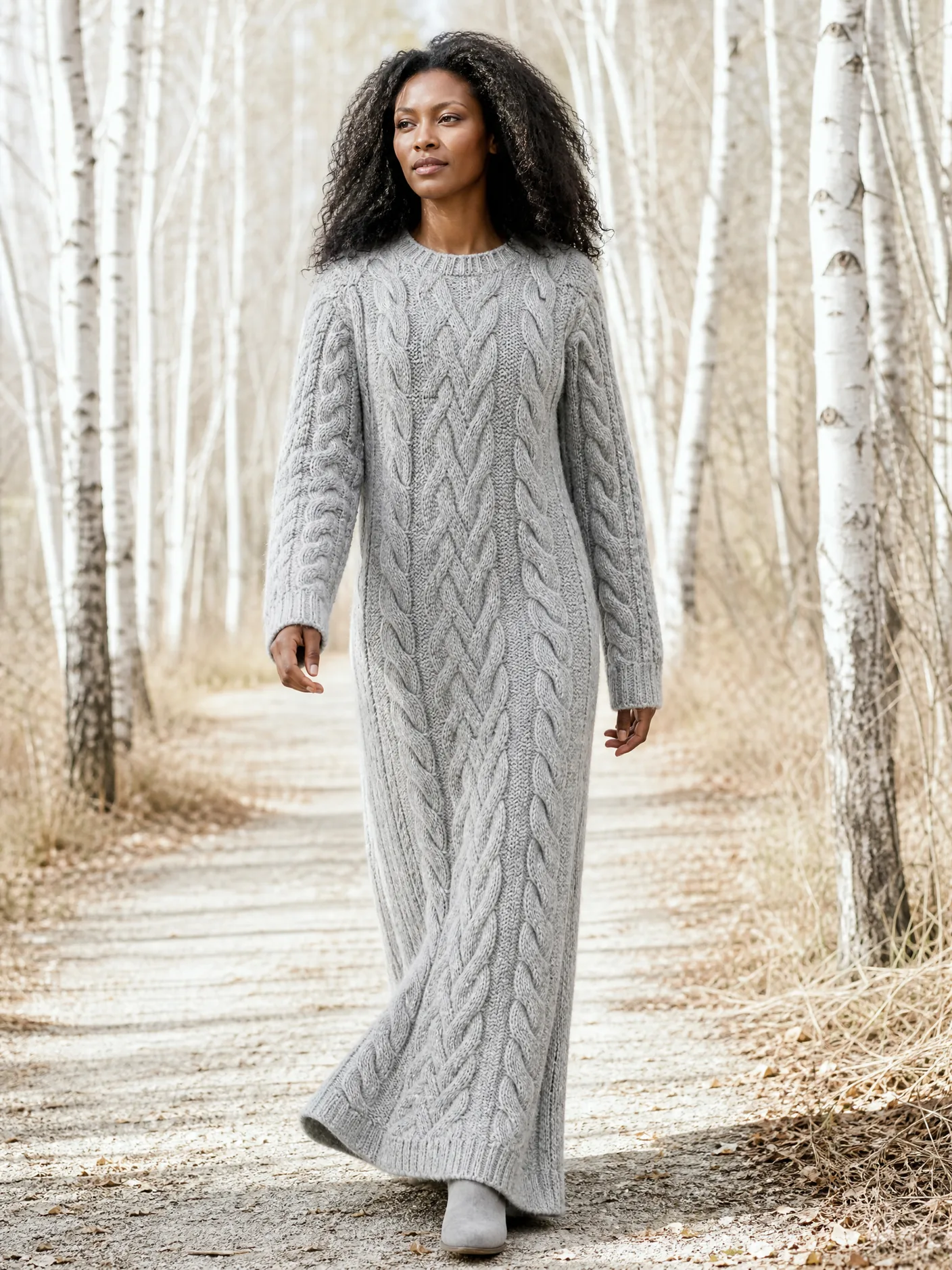 Illustration: a long grey cable-knit maxi dress among birch trees